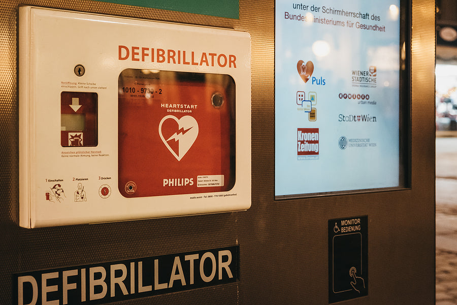 Defibrillator storage cabinet wall mount